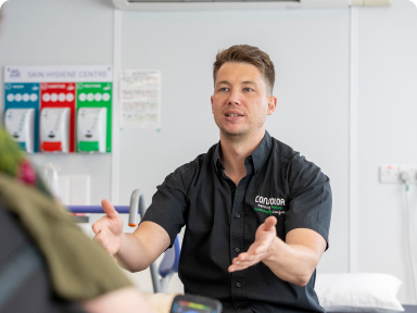 A photograph of a specialist seating technician who is wearing a Consolor-branded shirt.